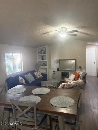 a view of a livingroom and a livingroom with furniture