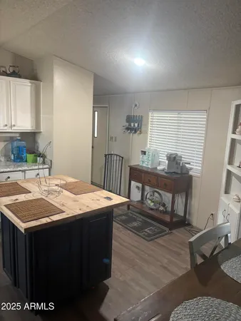 a white toilet sitting next to a white wall