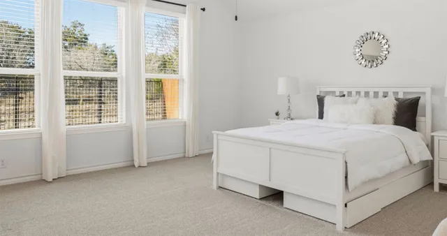 a bedroom with a bed and a couch