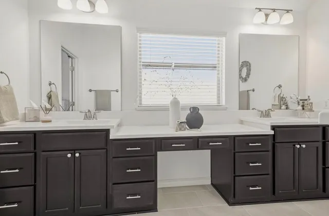 a bathroom with a bathtub sink and mirror