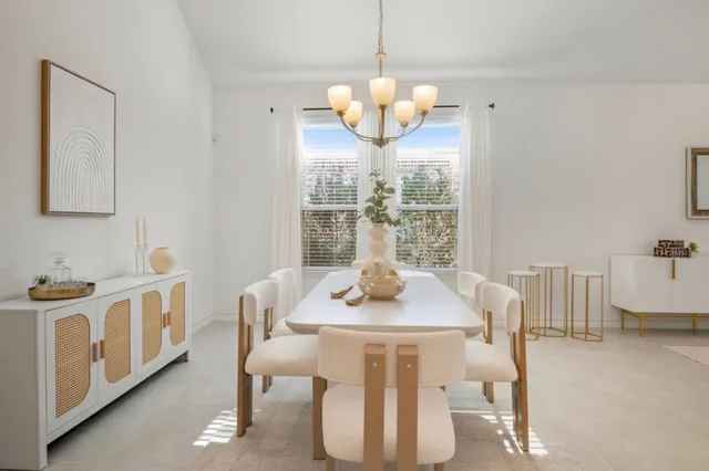 a dining room with furniture and window