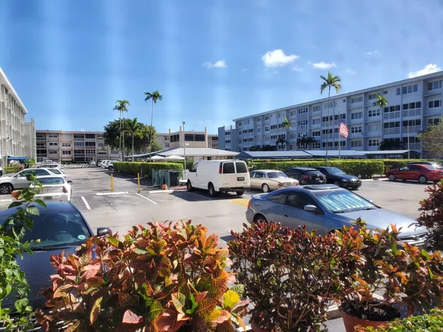 a view of a street with cars
