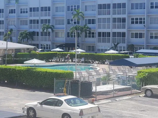 a front view of a building with garden