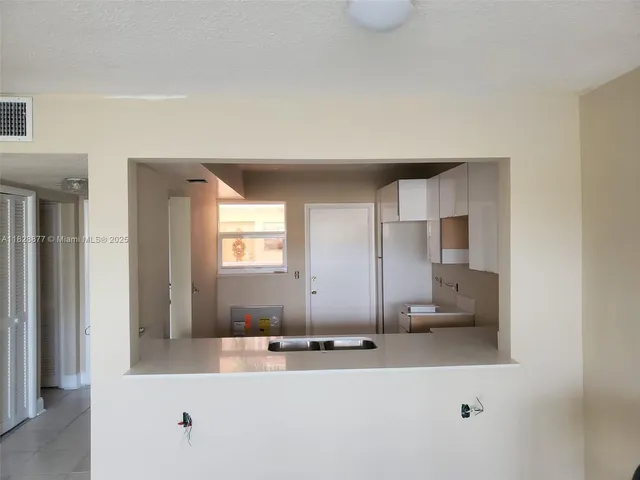 a bathroom with a sink a mirror and a