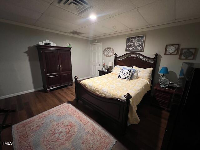 124 Don Ron Road Erwin, NC 28339 - Photo 24 of 67 a bedroom with a bed and wooden floor