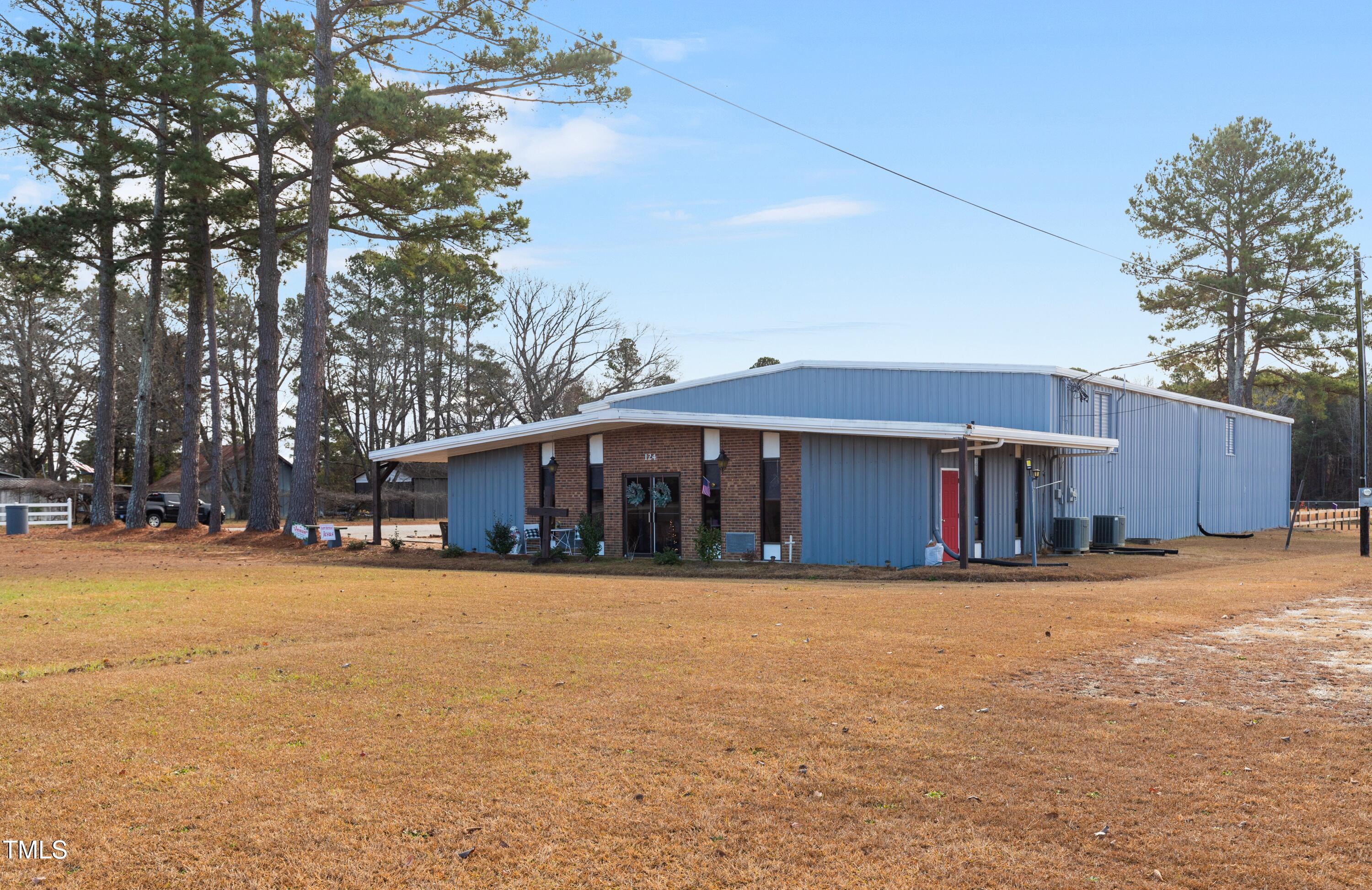 124 Don Ron Road Erwin, NC 28339 - Photo 4 of 67 a view of a house with a yard and garage