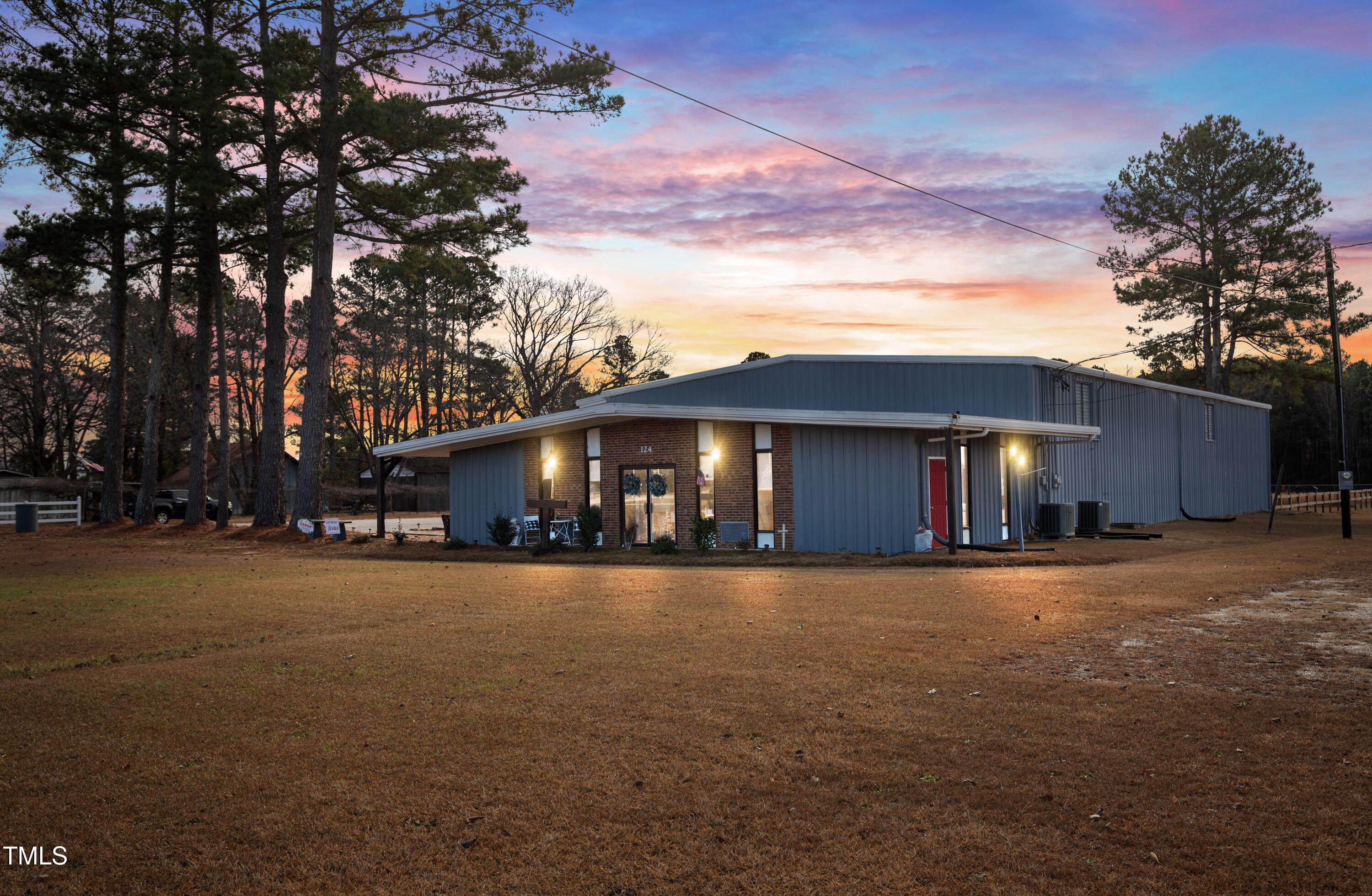 124 Don Ron Road Erwin, NC 28339 - Photo 5 of 67 a view of a house with a yard and garage