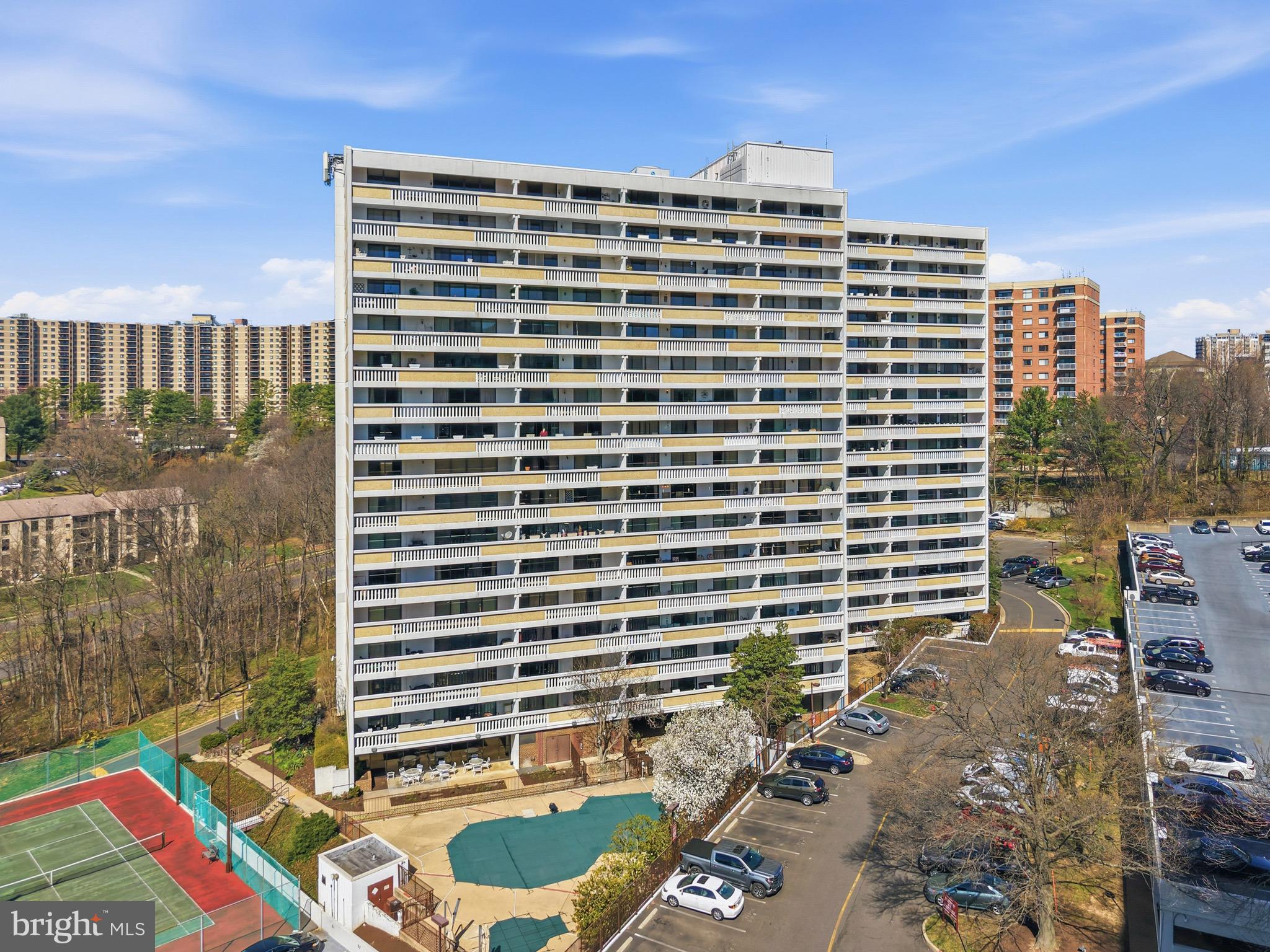 6101 Edsall Road, Unit 602 Alexandria, VA 22304 - Photo 38 of 38 a front view of a building with a yard