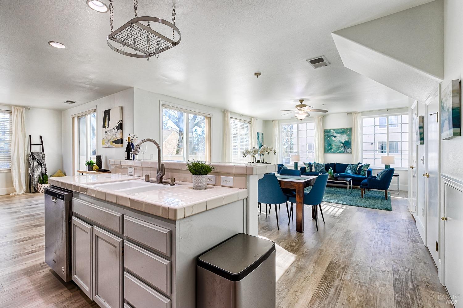 a view of a kitchen counter space dining table and chairs