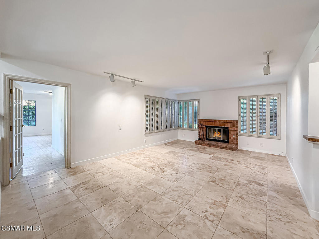 4007 Doneva Road Moorpark, CA 93021 - Photo 16 of 58 a view of empty room with furniture and a fireplace