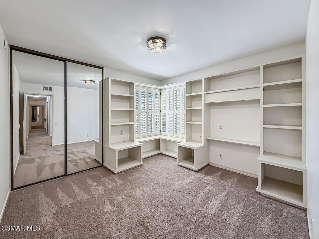 4007 Doneva Road Moorpark, CA 93021 - Photo 31 of 58 a view of an empty room with a closet and a cabinet