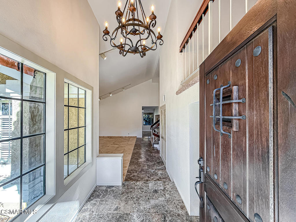 4007 Doneva Road Moorpark, CA 93021 - Photo 4 of 58 a view of a hallway with wooden floor and staircase