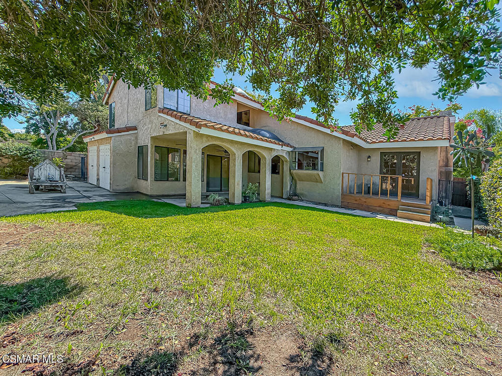 4007 Doneva Road Moorpark, CA 93021 - Photo 55 of 58 a view of a house with a big yard potted plants and large tree