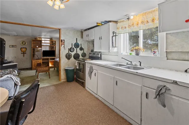 a view of a livingroom with furniture and window