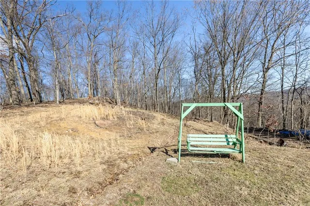 a backyard of a house with yard and outdoor seating