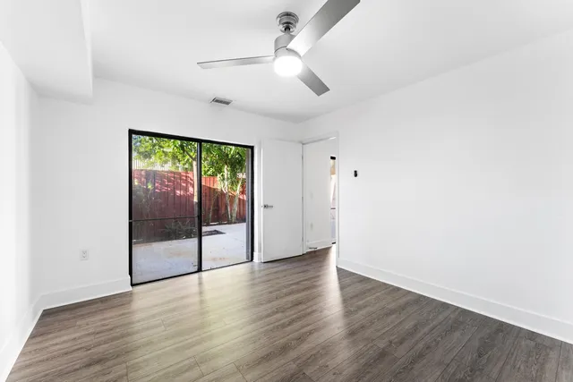 a bathroom with a sink mirror and toilet