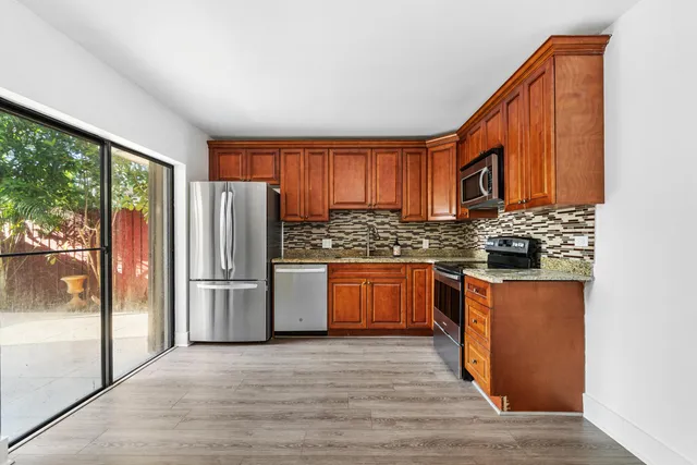 a view of entryway with wooden floor