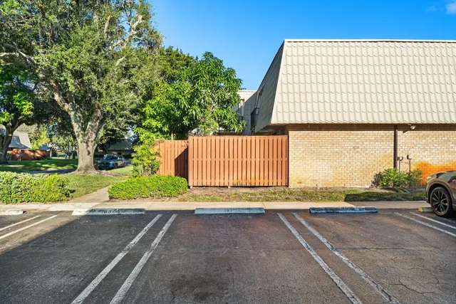 a view of a backyard with potted plants