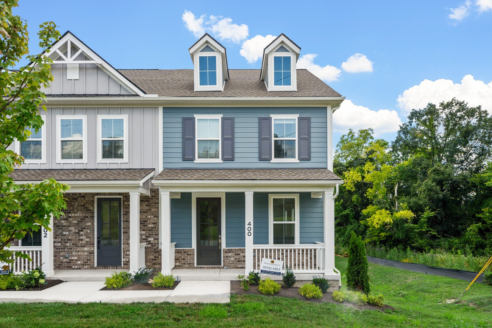 front view of a house with a yard