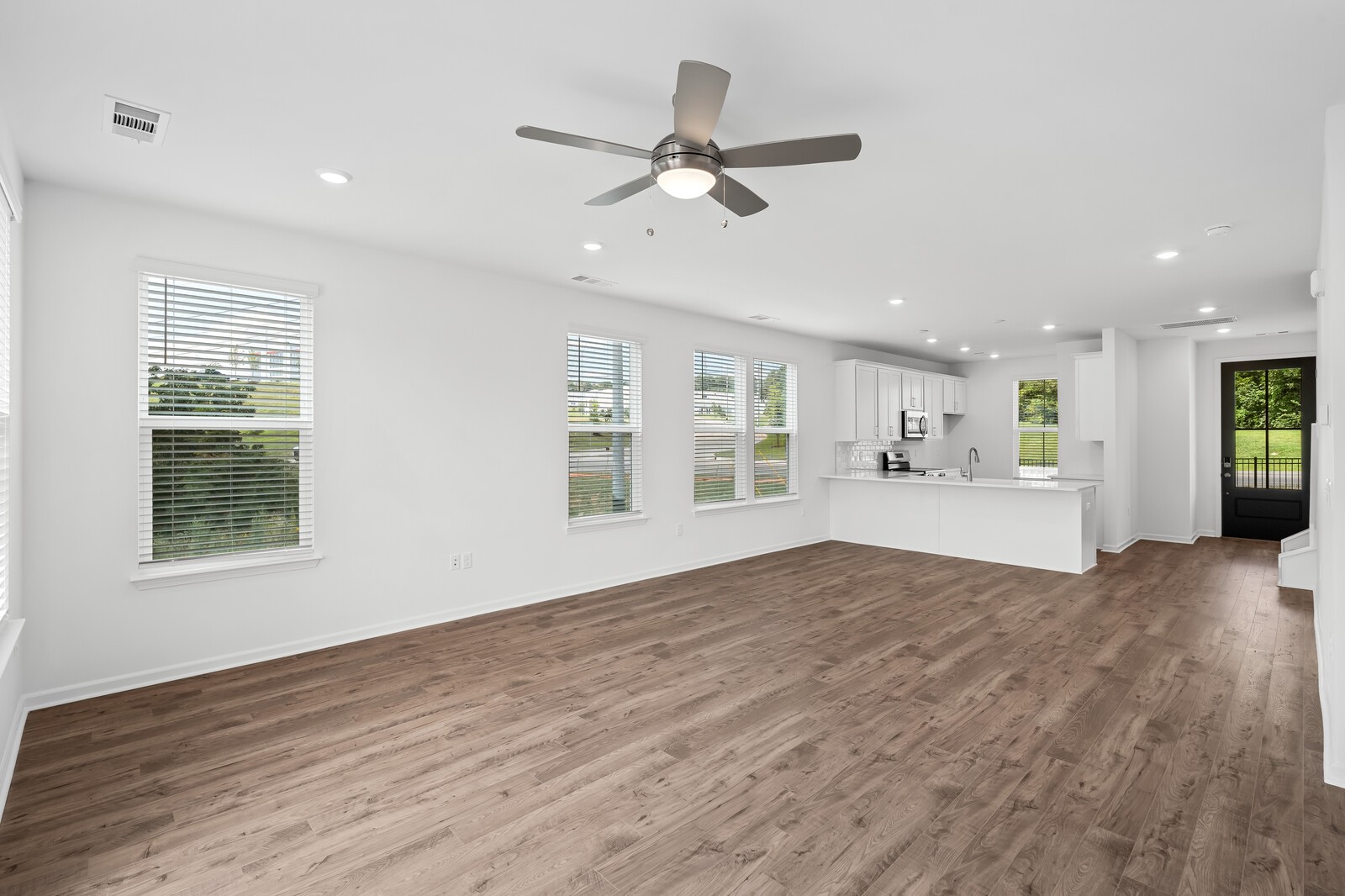 400 Blair Road Smyrna, TN 37086 - Photo 12 of 37 a view of an empty room with a window and wooden floor