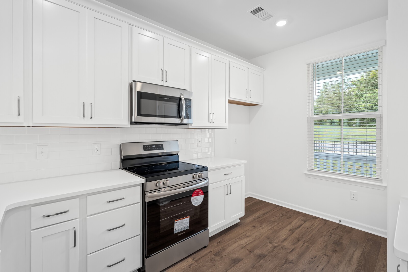 400 Blair Road Smyrna, TN 37086 - Photo 15 of 37 a kitchen with stainless steel appliances white cabinets and a stove top oven