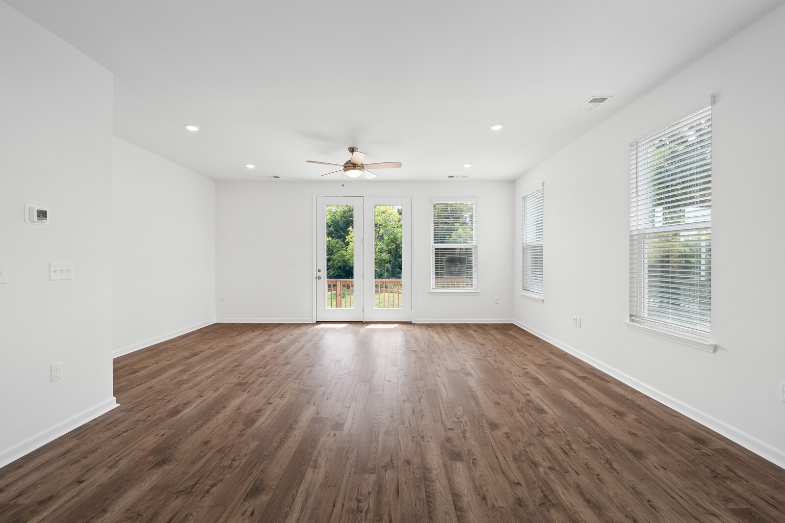 400 Blair Road Smyrna, TN 37086 - Photo 10 of 37 a view of an empty room with wooden floor and a window