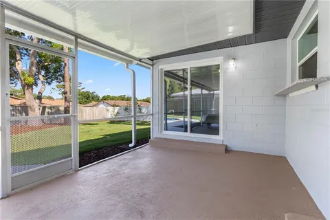 a view of a porch with furniture and front door