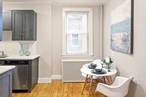 52 Strathmore Road, Unit 25 Boston, MA 02135 - Photo 6 of 12 a dining room with furniture and window