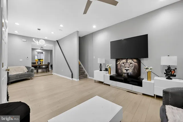 a view of a livingroom with furniture and a flat screen tv