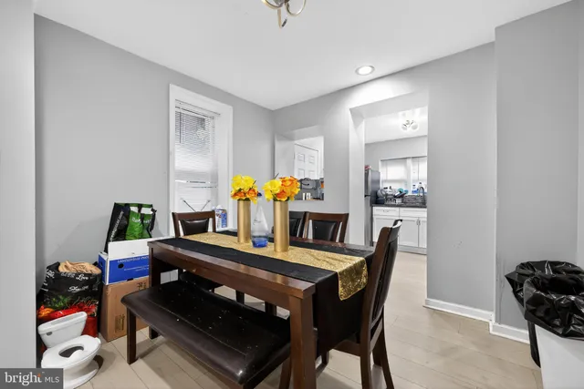 a dining room with furniture and natural light