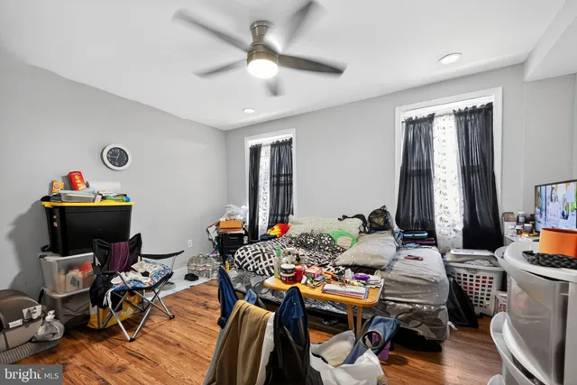 a work room with furniture and wooden floor