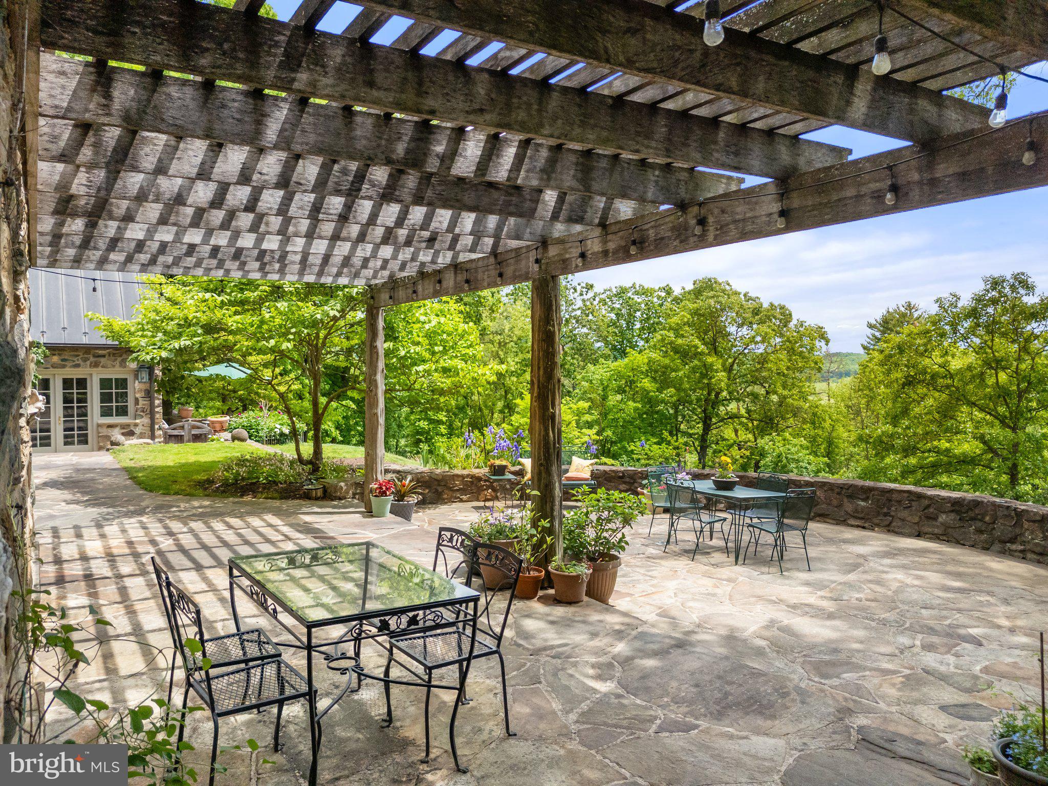 4392 Carrington Road Markham, VA 22643 - Photo 35 of 59 a view of a patio with a table chairs and a patio