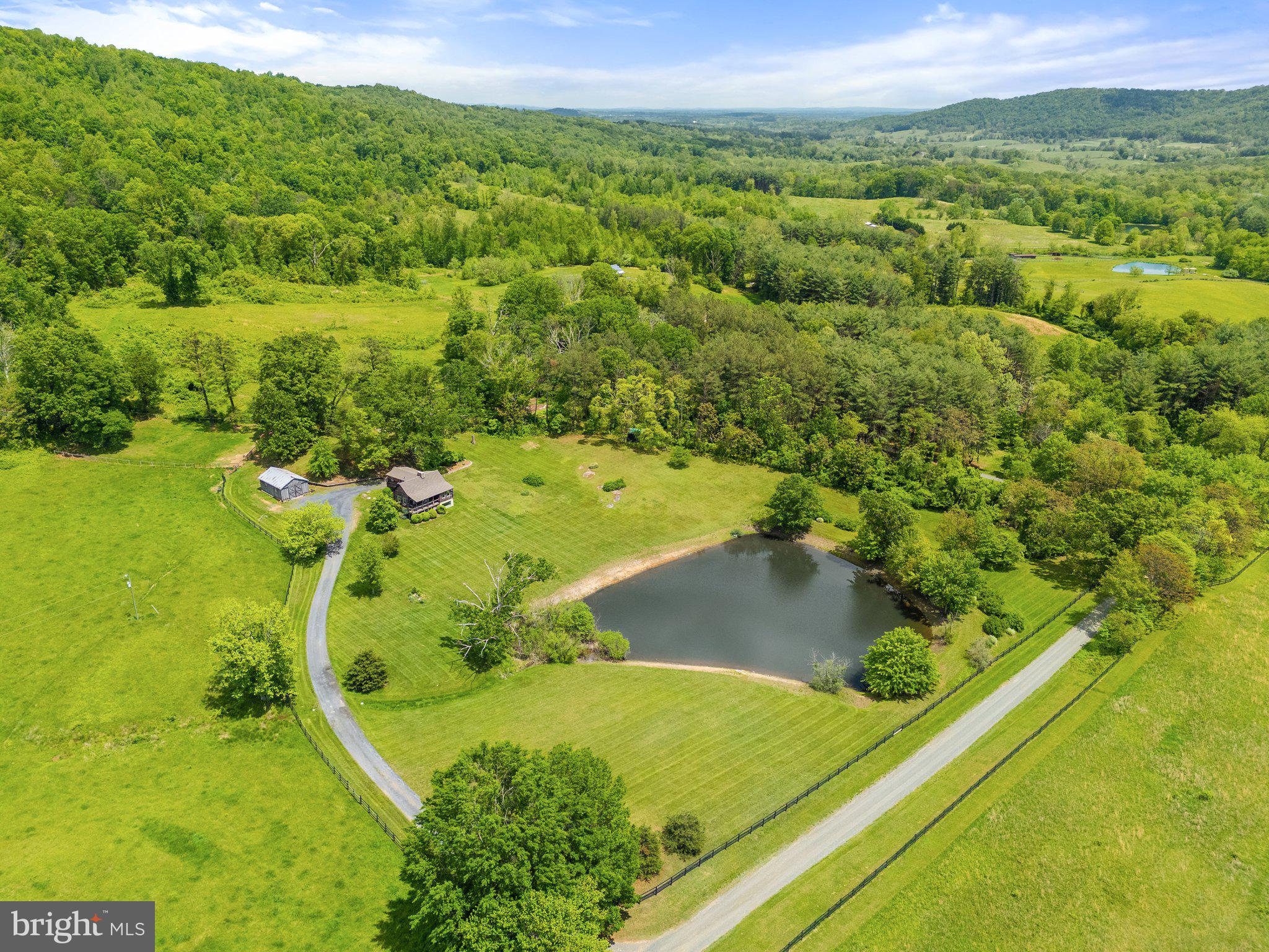 4392 Carrington Road Markham, VA 22643 - Photo 40 of 59 a view of a lake with a yard