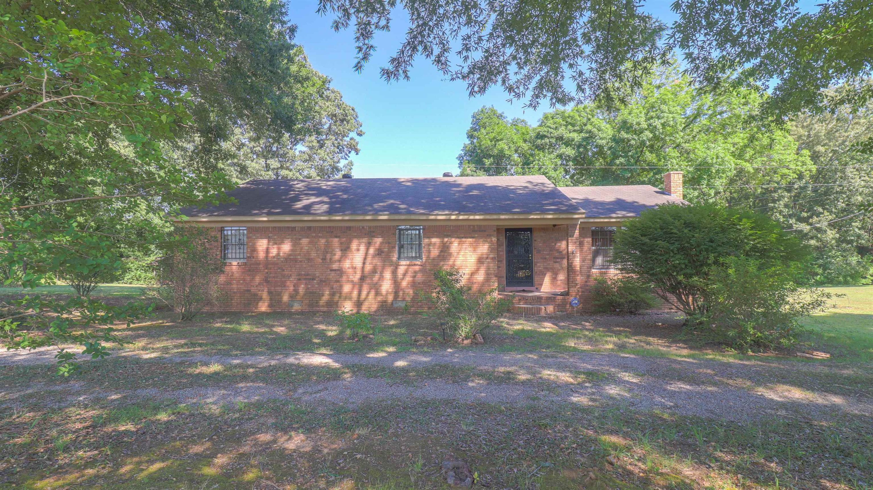 1040 Uptonville Road Mercer, TN 38392 - Photo 1 of 16 a view of a house with a yard