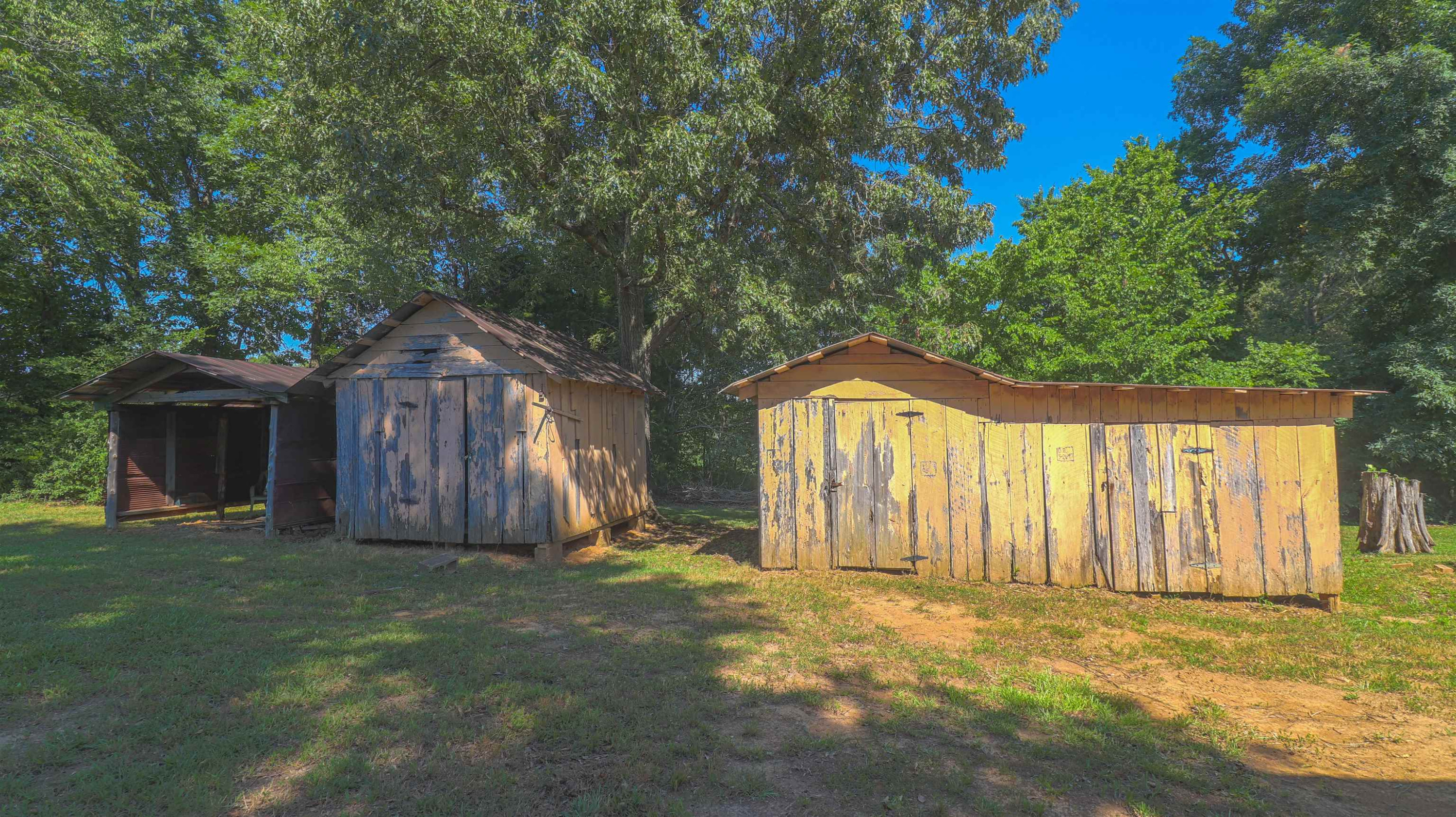 1040 Uptonville Road Mercer, TN 38392 - Photo 12 of 16 a front view of a house with a yard and garage
