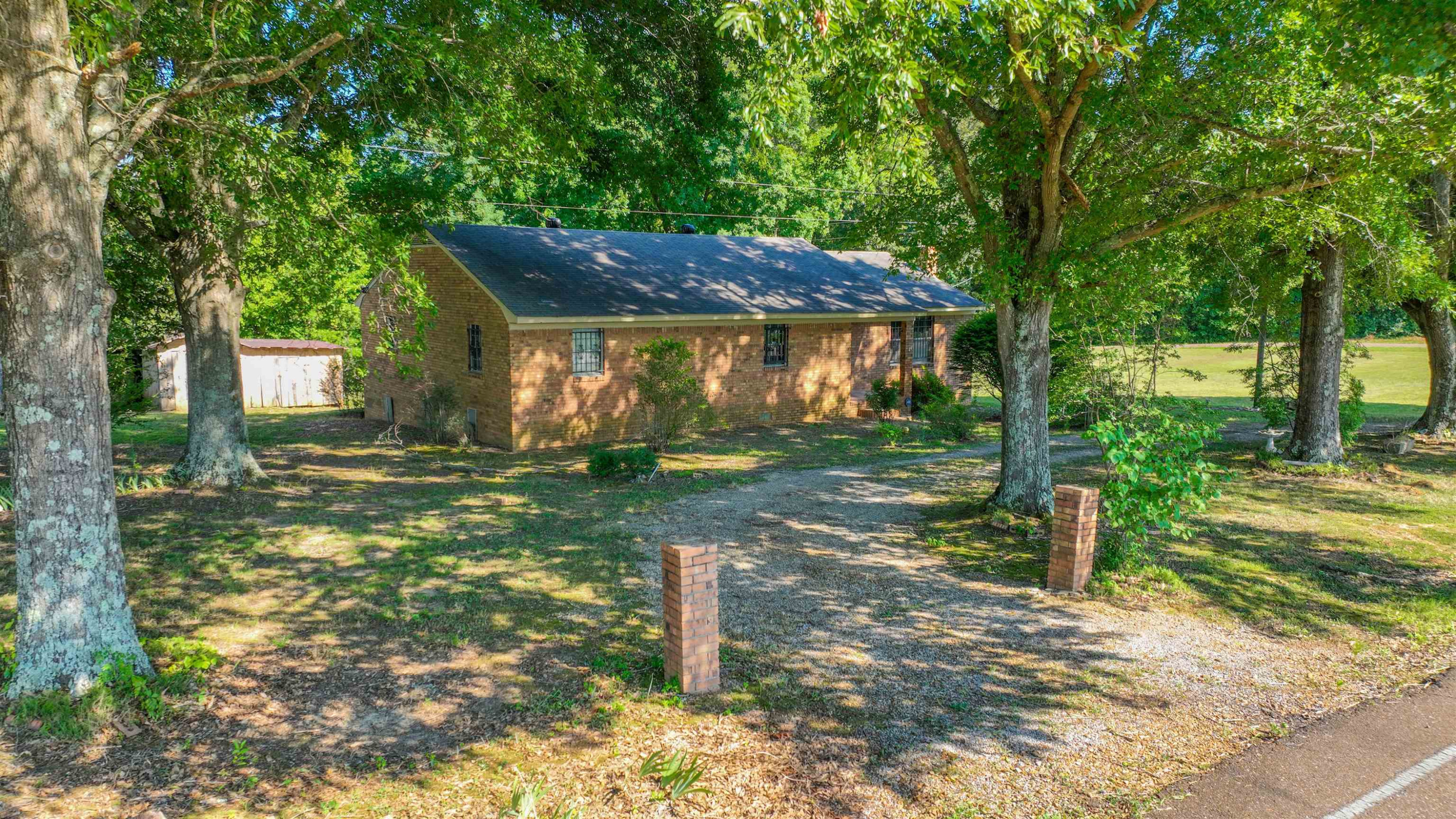 1040 Uptonville Road Mercer, TN 38392 - Photo 13 of 16 a backyard of a house with barbeque oven