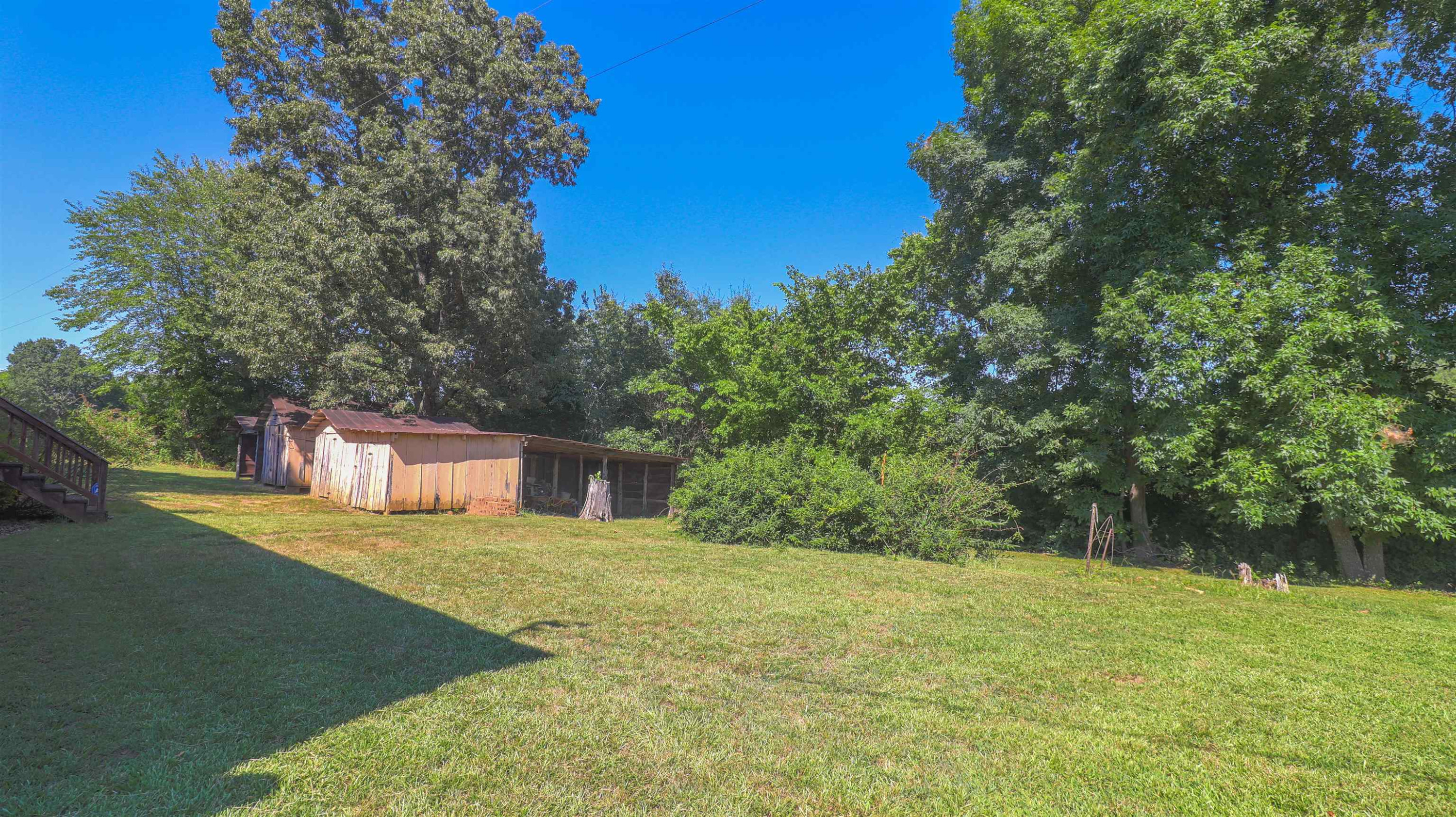 1040 Uptonville Road Mercer, TN 38392 - Photo 16 of 16 a view of a house with a yard