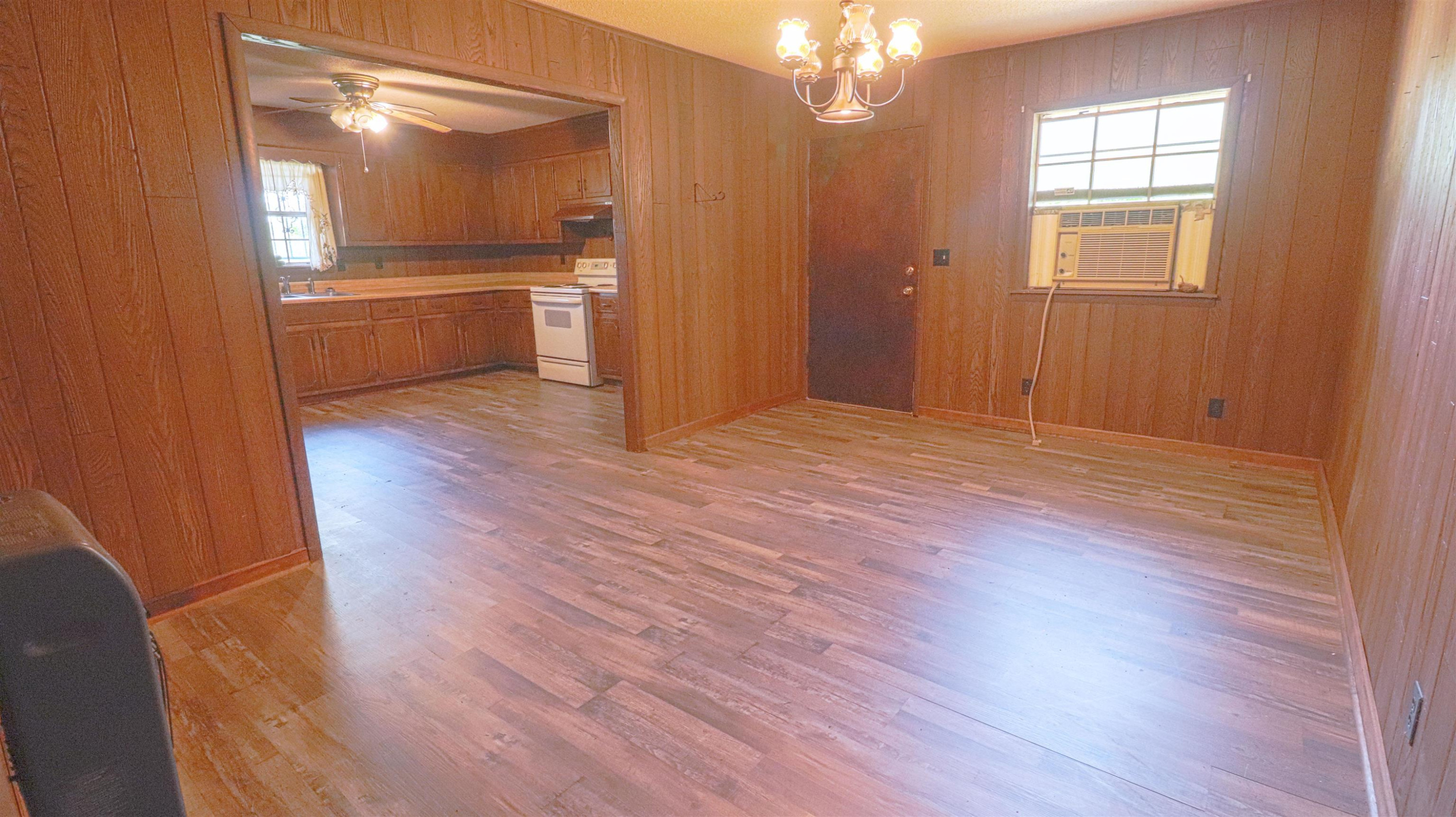 1040 Uptonville Road Mercer, TN 38392 - Photo 5 of 16 wooden floor in an empty room with a window