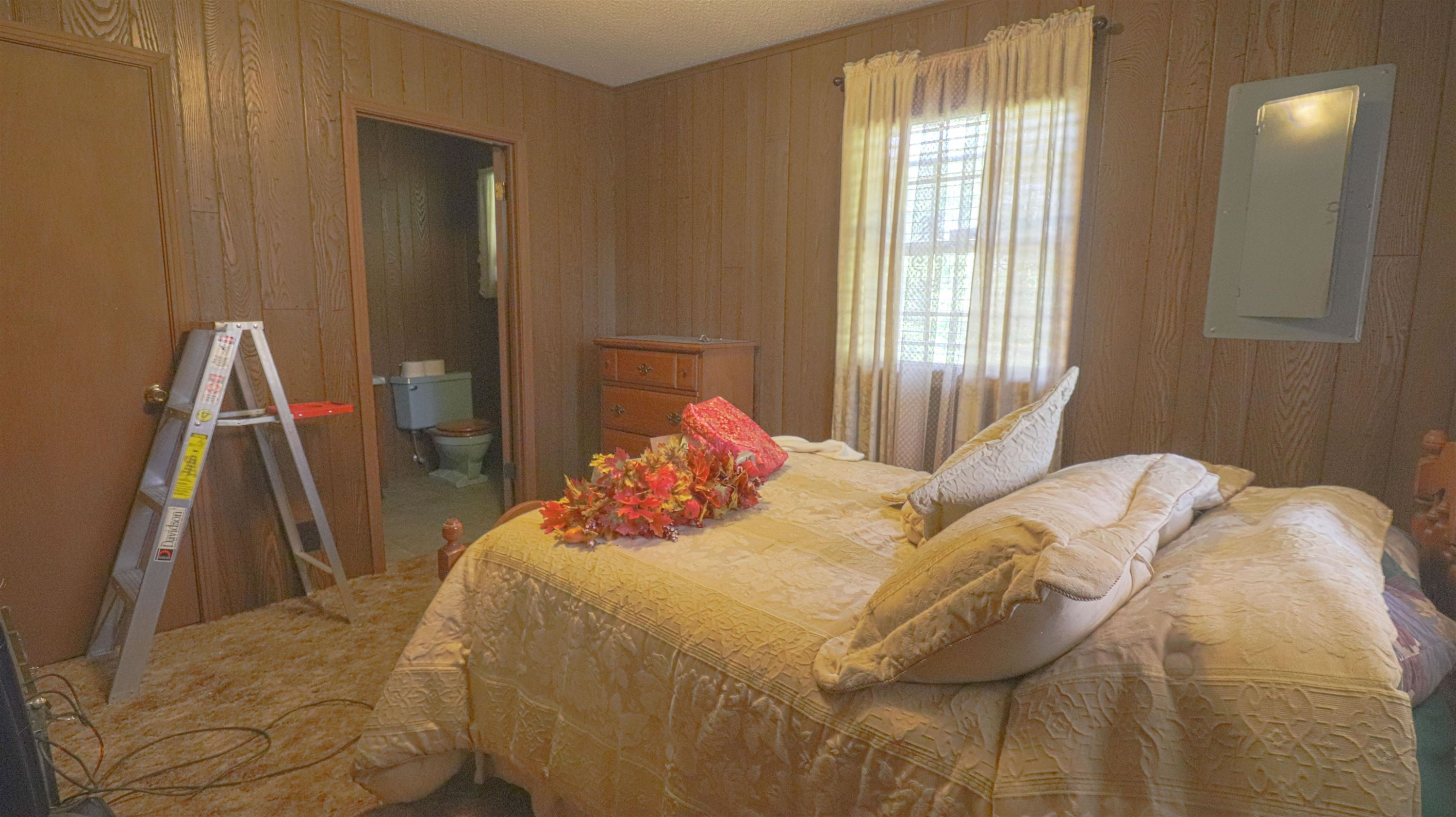 1040 Uptonville Road Mercer, TN 38392 - Photo 9 of 16 a bedroom with a bed and a window