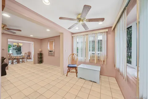 a living room with furniture and large window