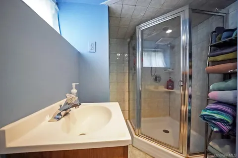 a bathroom with a sink and shower