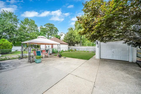 an outdoor space with furniture and umbrella