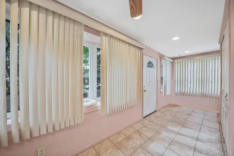 a view of a hallway with closet area