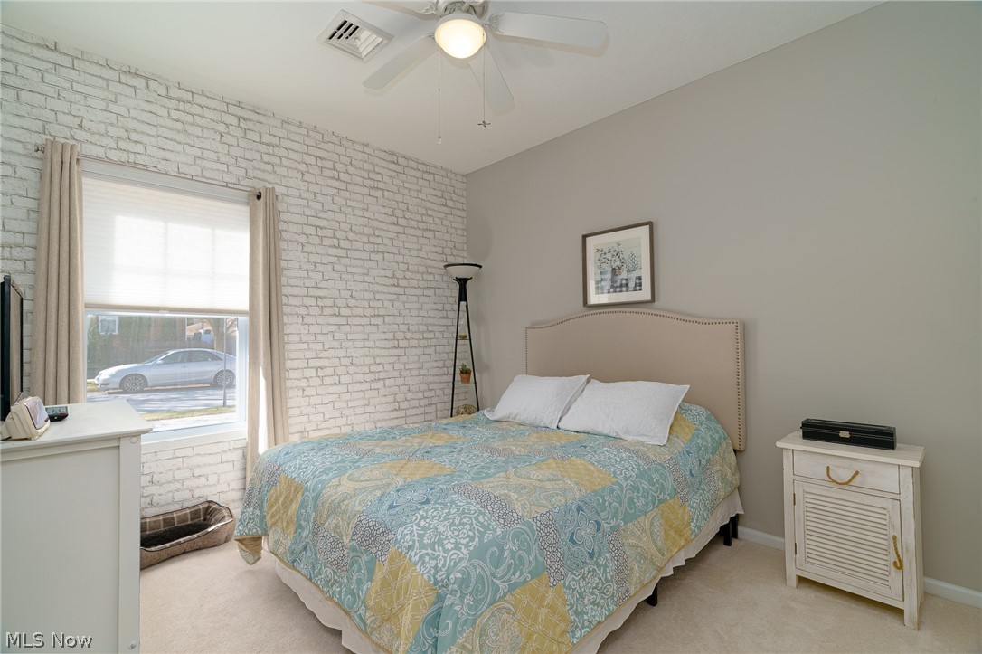 7462 Pearl Road Cleveland, OH 44130 - Photo 12 of 32 Spare bedroom with carpet, ceiling fan and large window.