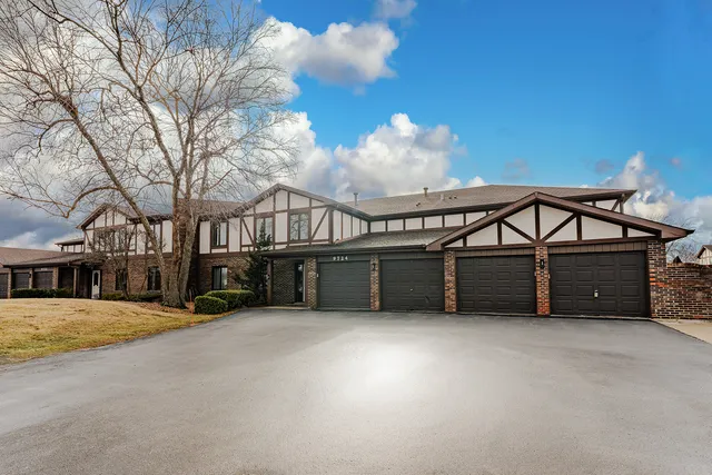 a view of a house with a snow in a yard