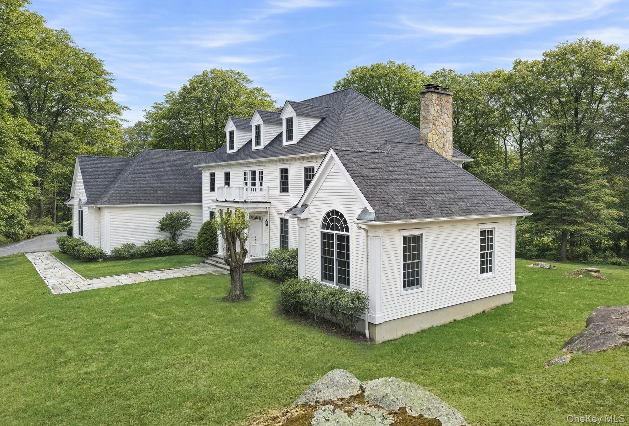 58 Old Logging Road Bedford, NY 10506 - Photo 28 of 34 a front view of a house with a yard