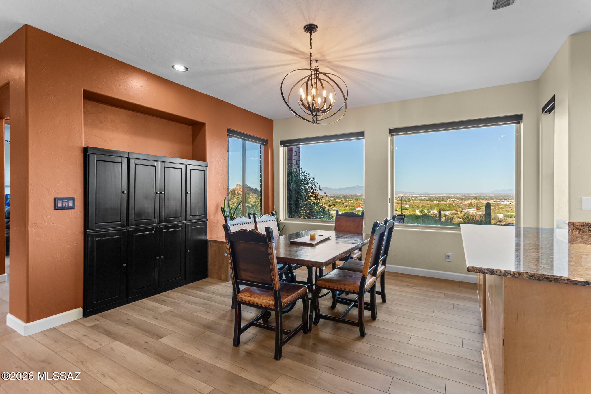 4210 West Mossman Road Tucson, AZ 85746 - Photo 9 of 51 a view of a dining room with furniture window and wooden floor