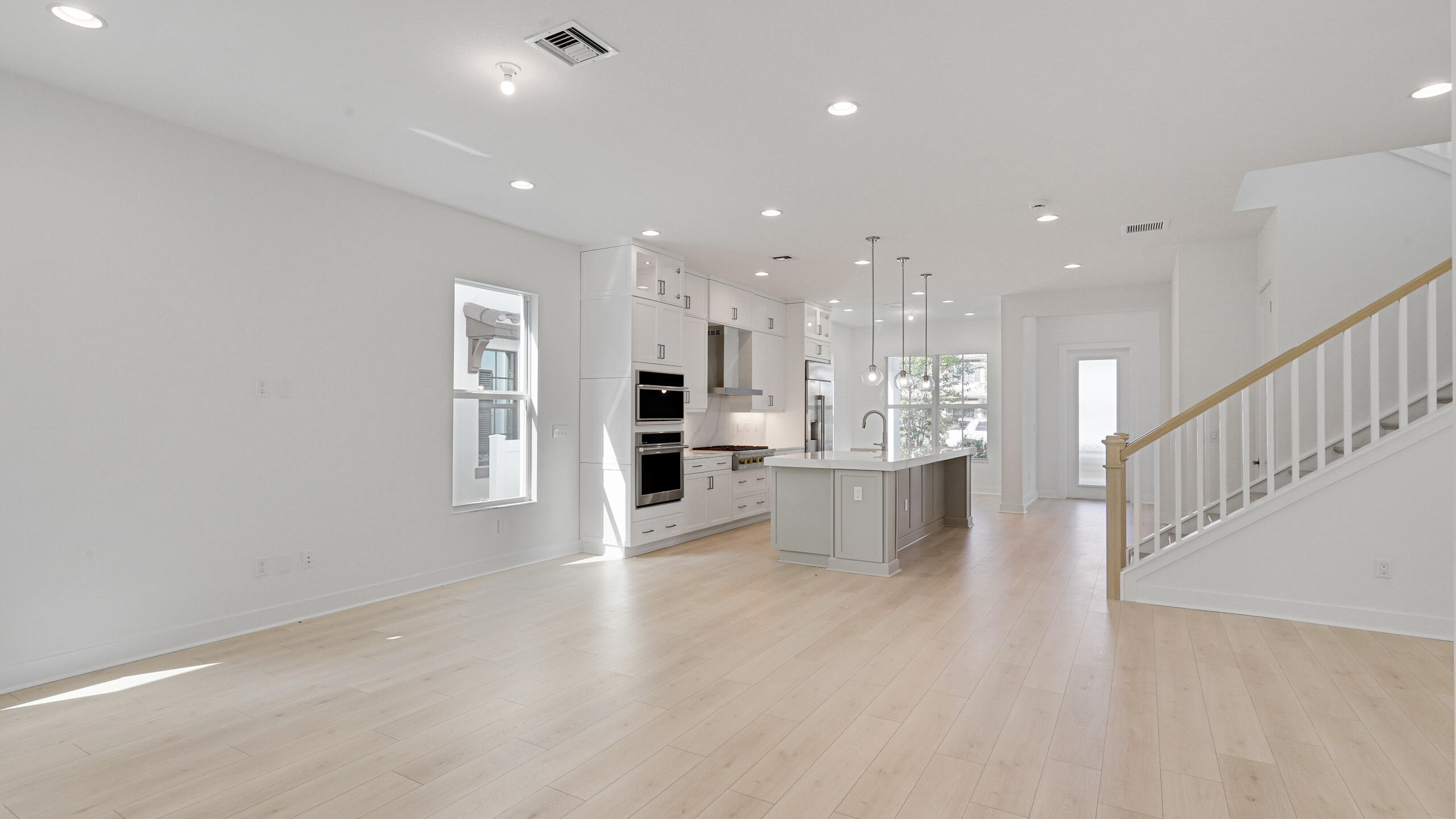 13150 Alton Road Palm Beach Gardens, FL 33418 - Photo 26 of 45 Great Room into Kitchen and Dinig