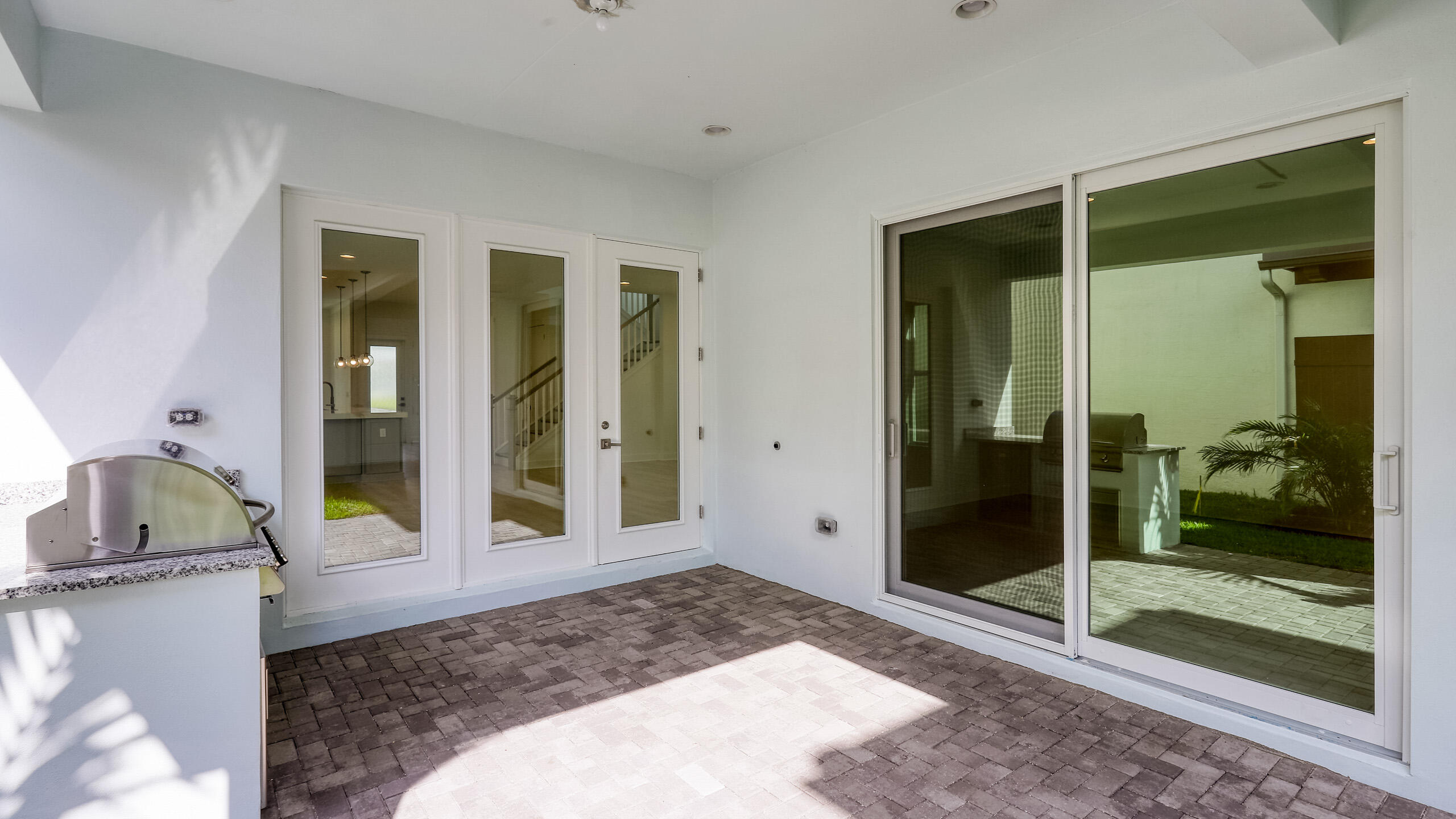 13150 Alton Road Palm Beach Gardens, FL 33418 - Photo 38 of 45 Loggia Summer Kitchen