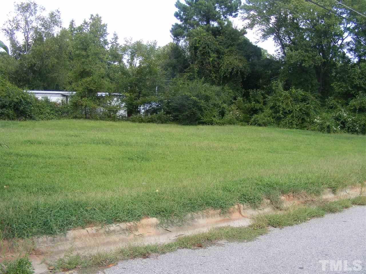 2530 Garner Road Raleigh, NC 27610 - Photo 3 of 4 a view of a field of grass and trees